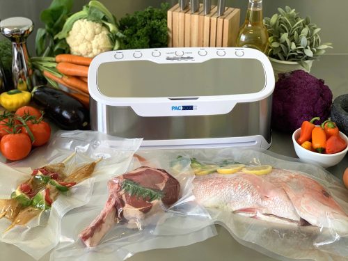 Grey and white vacuum sealer with vacuumed sealed fish